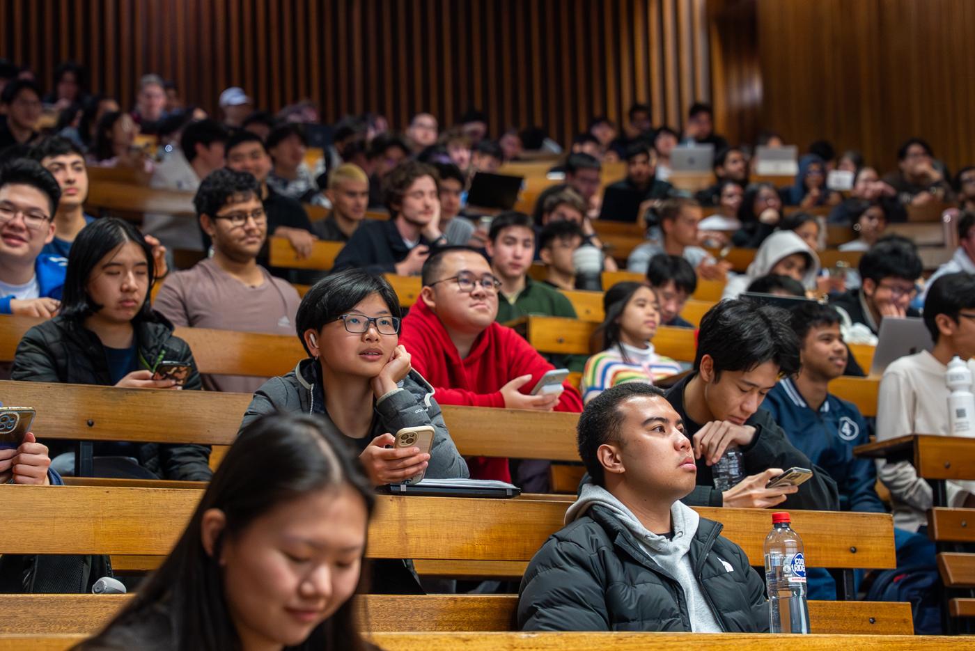 Students in a packed lecture theatre