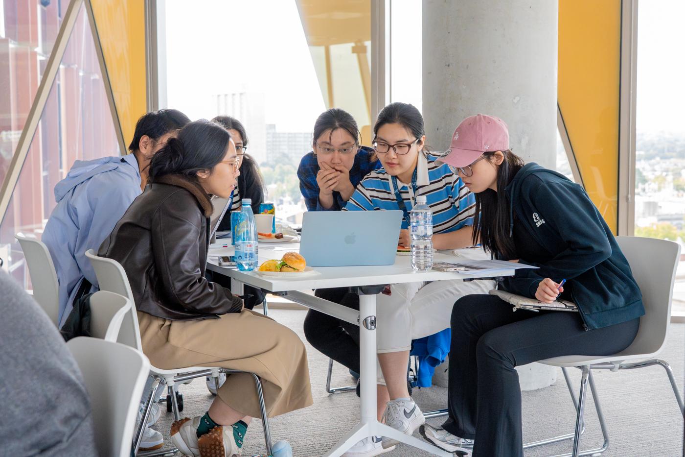 Students working together on a laptop