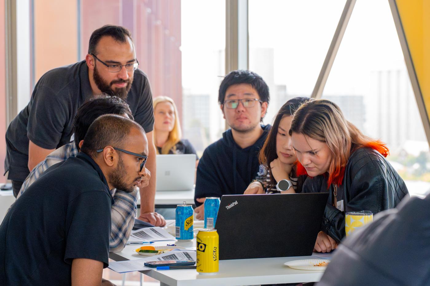 A mentor helping a student team